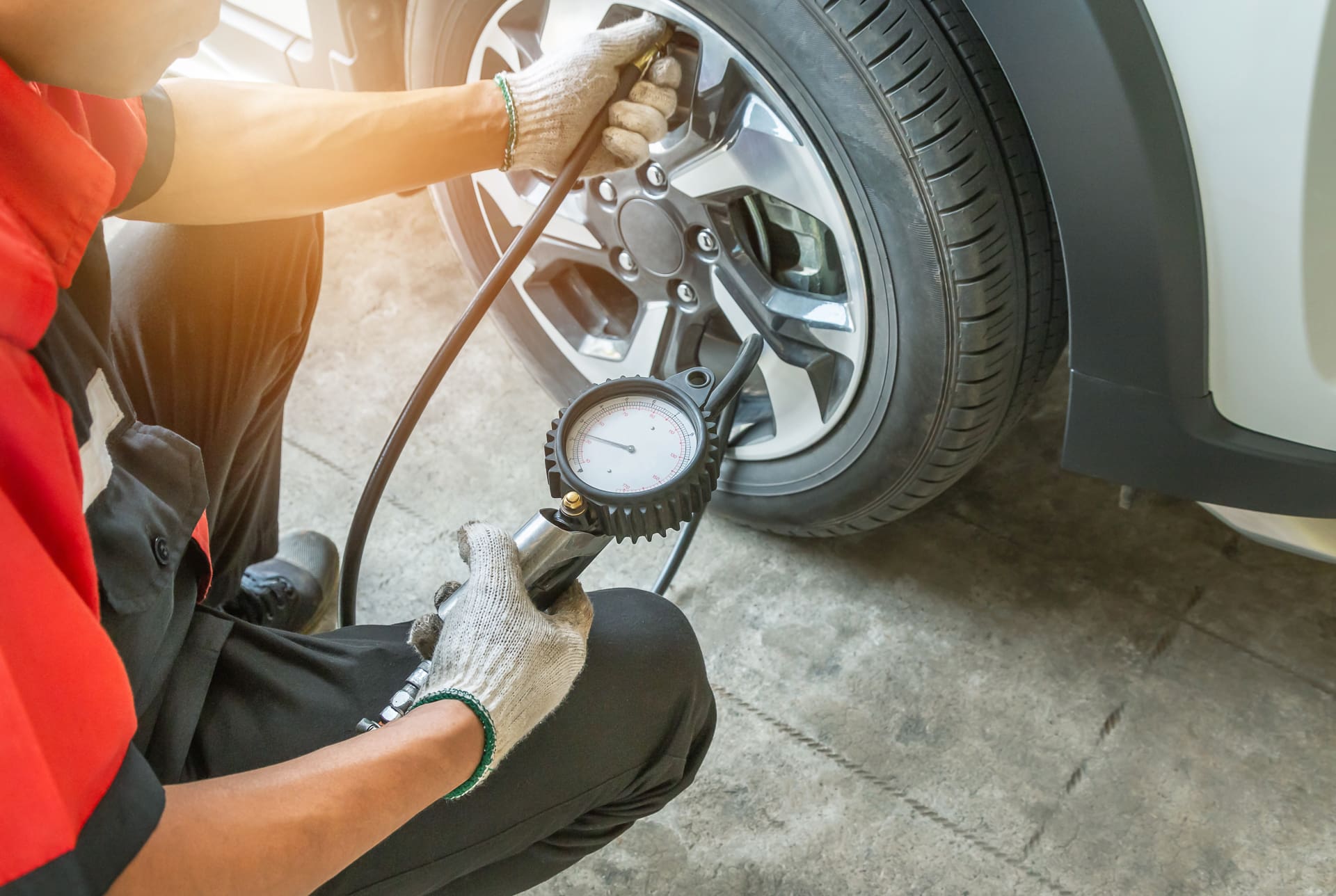 A man checks the tire pressure
