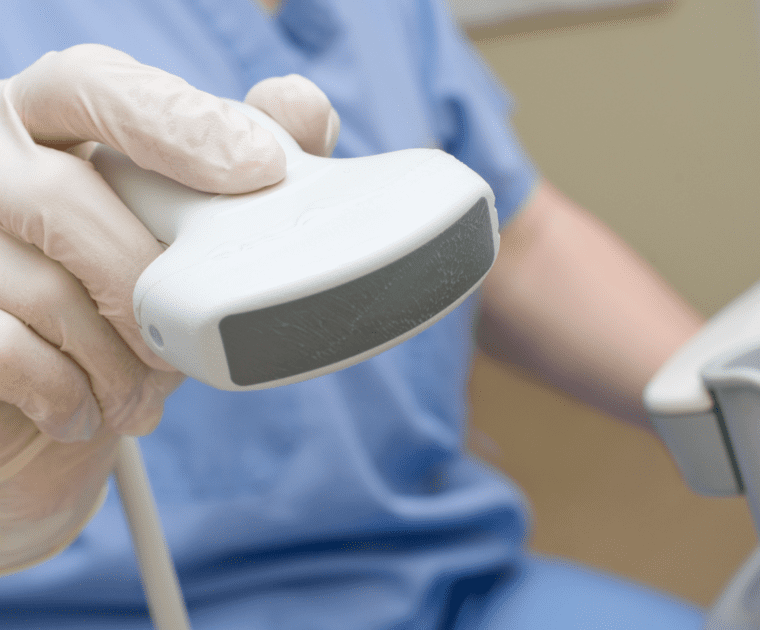 A person is holding a medical device