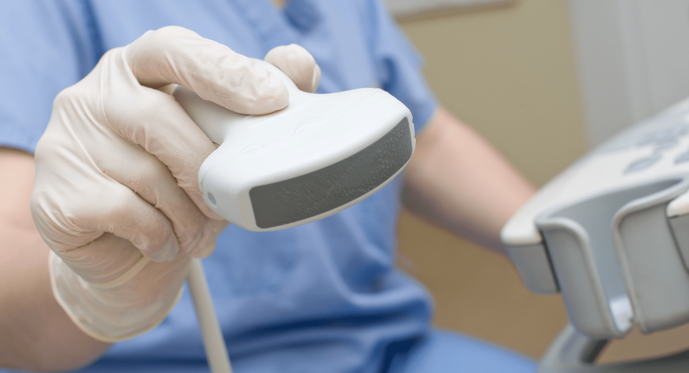 A person is holding a medical device