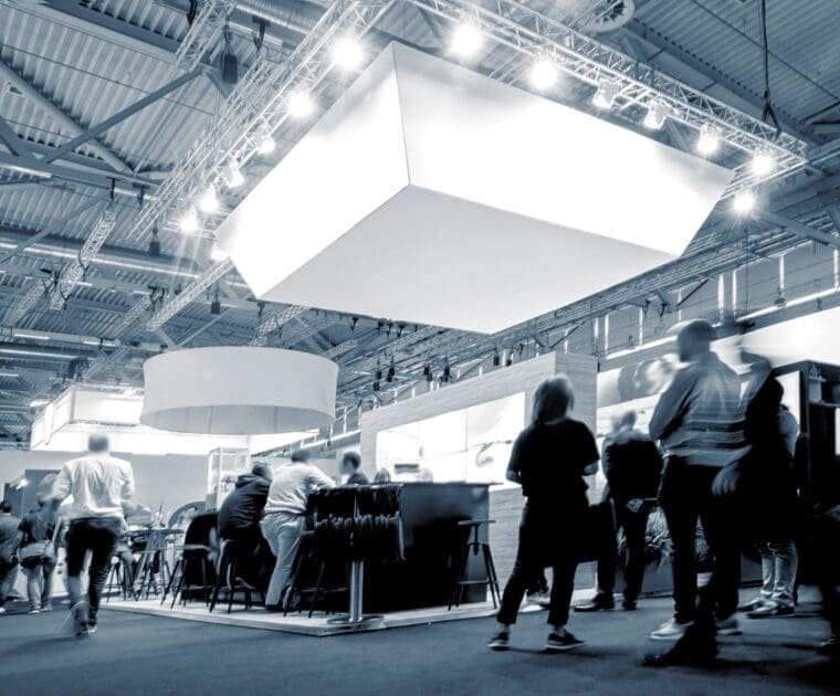 Obelis booth at a trade show with attendees