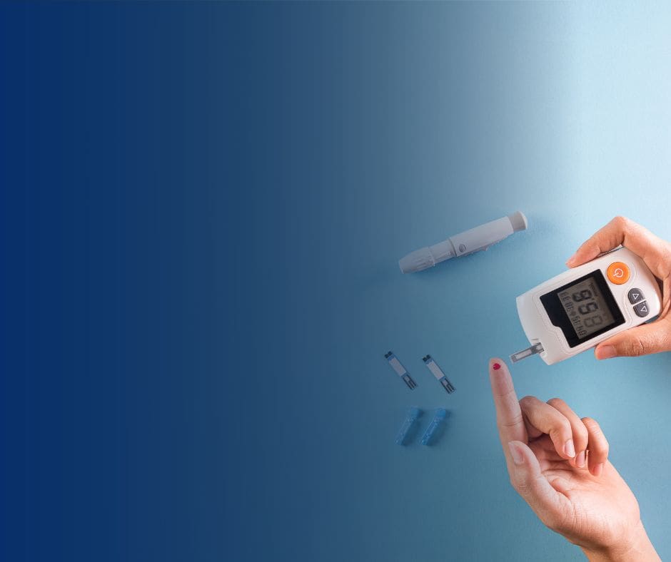 A hand gripping a digital blood glucose meter